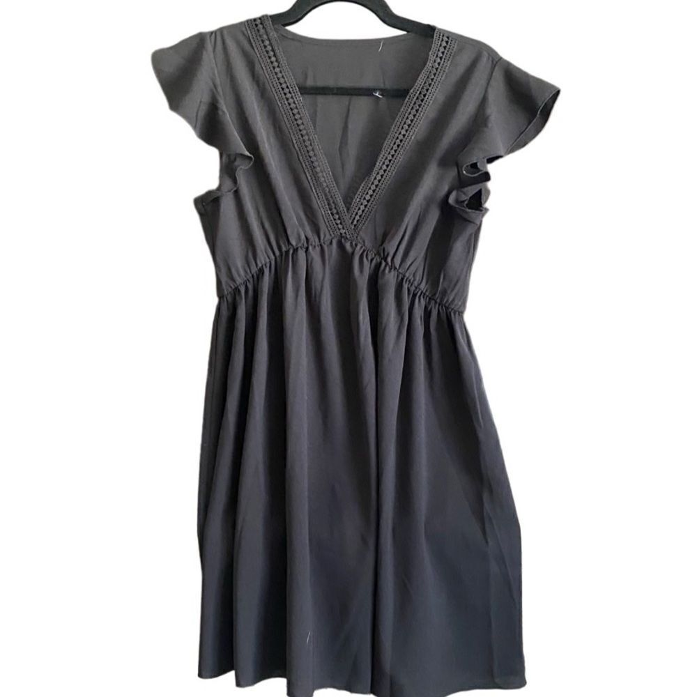 Flutter Sleeve Black Dress with Crocheted Detail at V-Neckline.